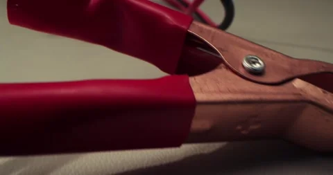 Close-up macro view of metal charging clamps. Charging clamps shown in macro Stock Footage 313965042