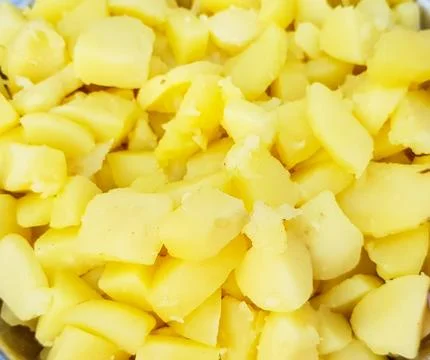 Close up macro view of small pieces of boiled potato Stock Photos
