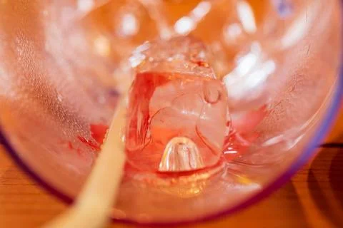 A close-up macro view of the transparent ice cubes and water droplets conde.. Stock Photos