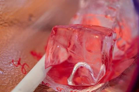 A close-up macro view of the transparent ice cubes and water droplets conde.. Stock Photos