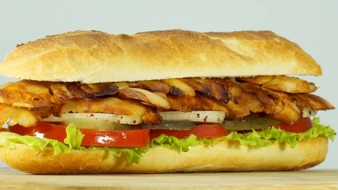 Close up, macro view of Turkish fast food chicken doner kebab sandwich. Video stock 94641079