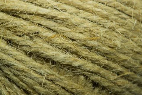 Close-up macro view of twine or string from natural fabric wrapped in a ball. 스톡 사진