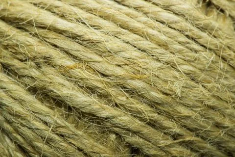 Close-up macro view of twine or string from natural fabric wrapped in a ball. Фото