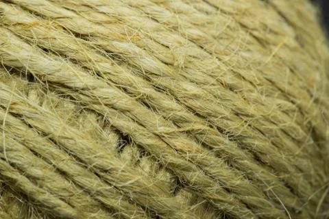 Close-up macro view of twine or string from natural fabric wrapped in a ball. Фото