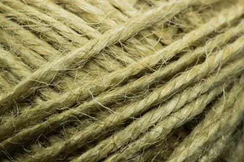Close-up macro view of twine or string from natural fabric wrapped in a ball. Stock-Fotos