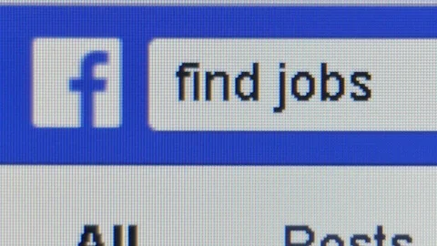 Close up macro view of the words 'find jobs' typed into Facebook search bar Stock Footage 94758215