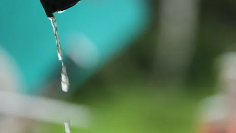 Close up macro water is pouring down Stock Footage 202300920
