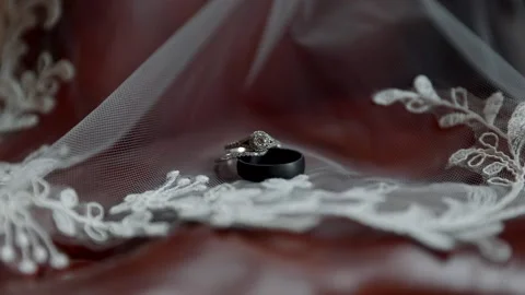 Close Up Macro of Wedding Engagement Ring on Veil on Brown Red Leather Stock Footage 149708788