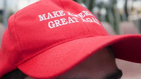 Close-up of a MAGA hat. Unidentified young Trump supporter wears a MAGA hat Video stock 136029375