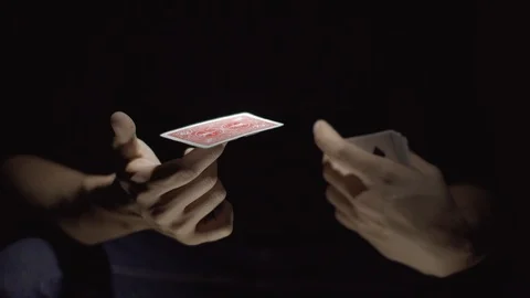 Close-up of a Magician's Hands Performing Card Trick. The card is spinning on Video stock 89580301
