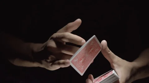 Close-up of a Magician's Hands Performing Card Trick. Manipulations with cards Stock Footage 89580425