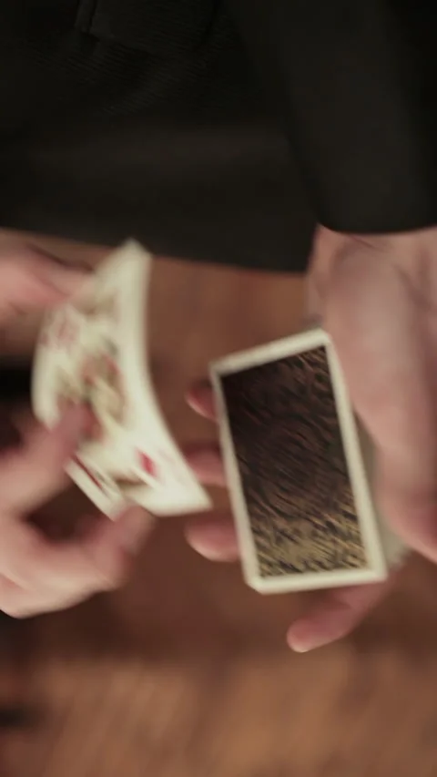 Close-up of a Magician's Hands Performing Card Trick. Vertical video. 動画素材 271127504