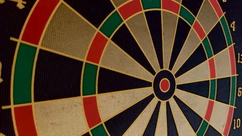 Close up of magnetic darts hitting a dartboard Vidéo 127776997