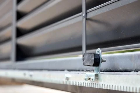 Close-up of magnetic limit switch bracket mounted on modern steel automatic s Stock Photos
