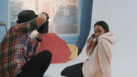 Close-up of make-up artist applying makeup on beautiful black model sitting on Stock-Footage 122575875