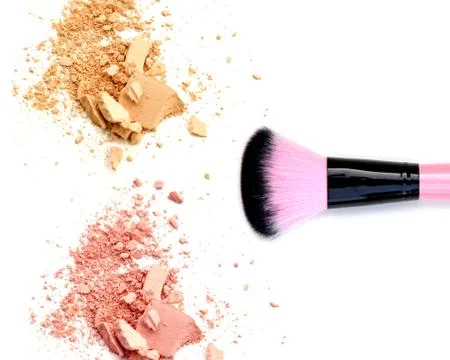 Close up of a make up powder and brush on white background Stock Photos