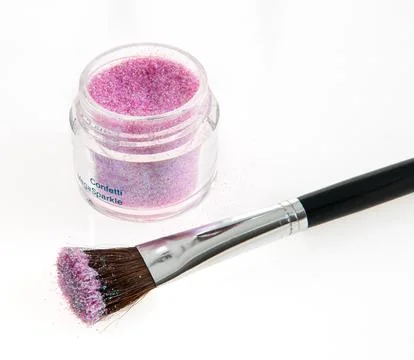 Close-Up of Makeup Brush and Glitter Jar with Sparkling Purple Pigment Stock Photos