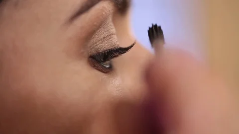 Close up of makeup brush moving over eye shadows Stock Footage 86417076