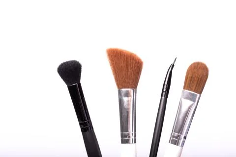 Close up makeup brush set isolated on white background. Beauty, face perfecting Stock Photos