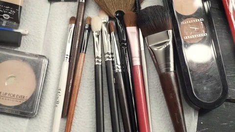 Close up makeup brushes and other cosmetics. 스톡 동영상 112023229
