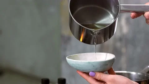 A close up of making candle process. Woman making decorative aroma candle Stock Footage 204141979
