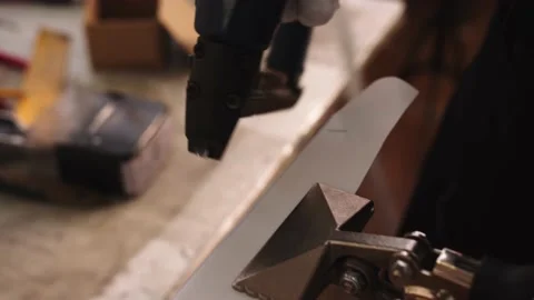 Close-up of making canvas for a painting in the art workshop. the hands in Stock Footage 201389153