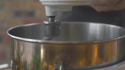 Close up making dough in kitchen mixer. Kitchen kneader machine mixing dough in Stock Footage 107984098
