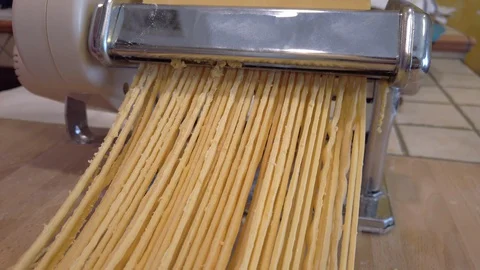 Close up making homemade uncooked long pasta tonnarelli (like spaghetti) Stock Footage 128812182