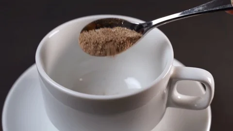 Close up of making hot instant coffee powder with white up Stock Footage 129815526