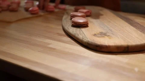 Close-up on making macarons shells with chocolate cream, Video stock 154740634