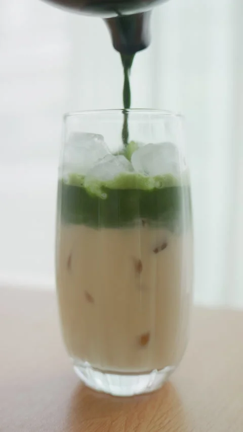 Close up of Making Refreshing Matcha Latte Drink at Home Stock Footage 340996416