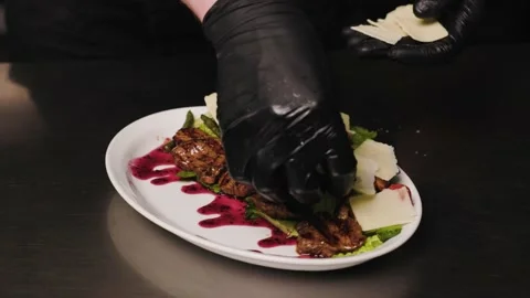 Close up of making salad. The cook puts parmesan to salad. Beef salad Stock Footage 232479325