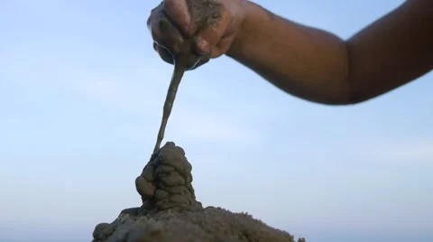 Close up of making sand castle on blue sky background. Slow motion Stock Footage 50148428