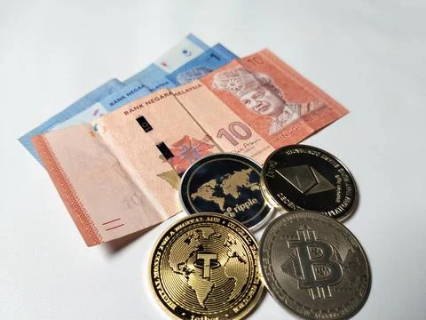 Close-up of Malaysian 1 Ringgit and 10 Ringgit banknotes with illustrations  Stock Photos