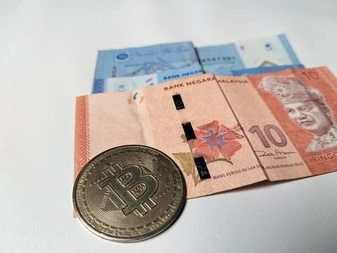 Close-up of Malaysian 1 Ringgit and 10 Ringgit banknotes with illustrations Foto stock