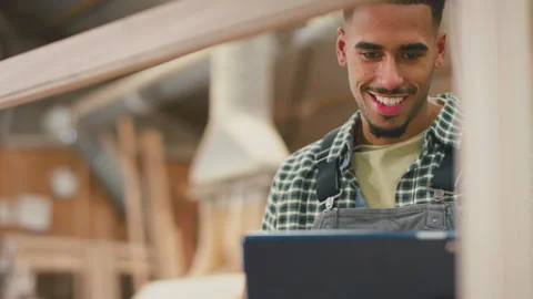 Close Up Of Male Apprentice Working As Carpenter In Furniture Workshop Using 스톡 동영상 242320434