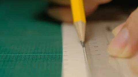 Close-up of male architect hands drawing a line on white paperboard. Stock Footage 97150442