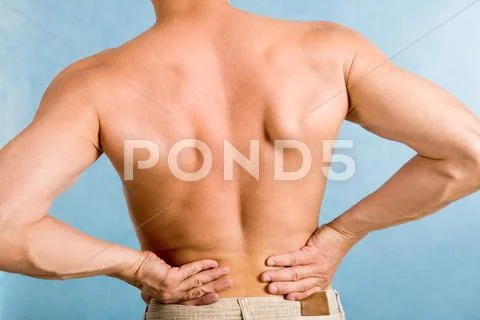 Close-up of male back over blue background Stock Photos