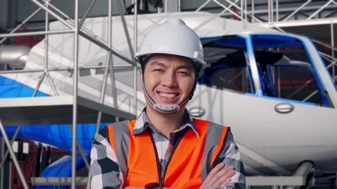 Close Up Of Male Engineer Crossing His Arms and Inspecting Helicopter Stock Footage 312126655