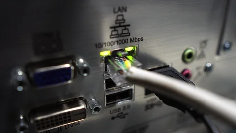 Close-up of male engineers are connected to cable systems of communication Stock Footage 120072091