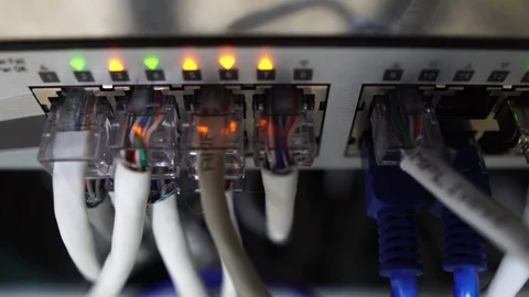 Close-up of male engineers are connected to cable systems of communication 動画素材 120072328