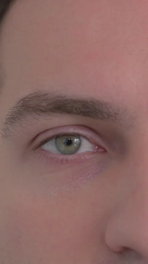 Close up of Male Eyes looking at Camera, vertical video Video stock 324792980