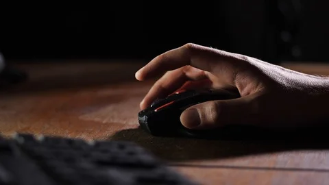 Close up. A male hand drives a computer mouse over the table. 4K Slow Mo Stock-Footage 105280898