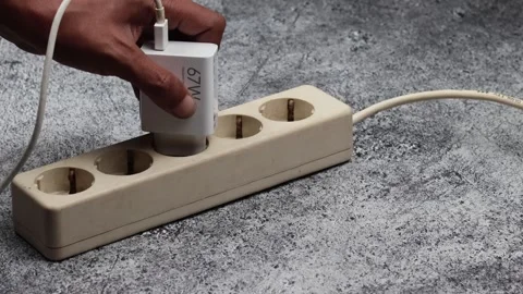 Close up male Hand insert a plug of the phone adapter Stock Footage 307004265