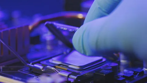 Close-up of male hand Installing a computer processor CPU. Personal computer Stock Footage 194644076