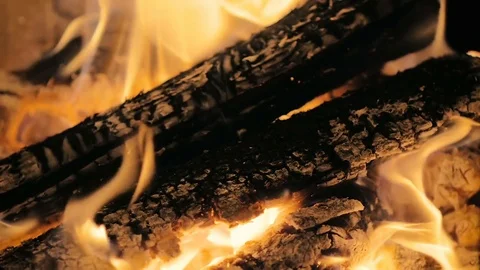 Close-up of a male hand opens the fireplace door with slowly burning wood. Stock Footage 83545586