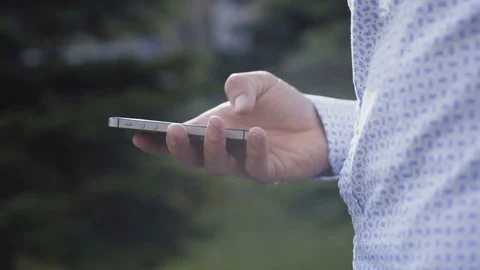 Close up of male hand using smartphone on background. 4K Stock Footage 82911738