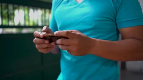 Close up of male hand using smartphone and playing mobile game. Stock Footage 277170763