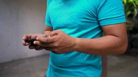 Close up of male hand using smartphone and playing mobile game. Stock Footage 277170798
