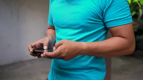 Close up of male hand using smartphone and playing mobile game. Stock Footage 277170823